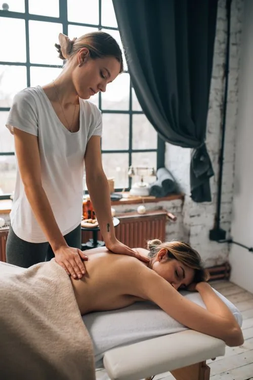 Professional massage specialist providing a relaxation-focused massage