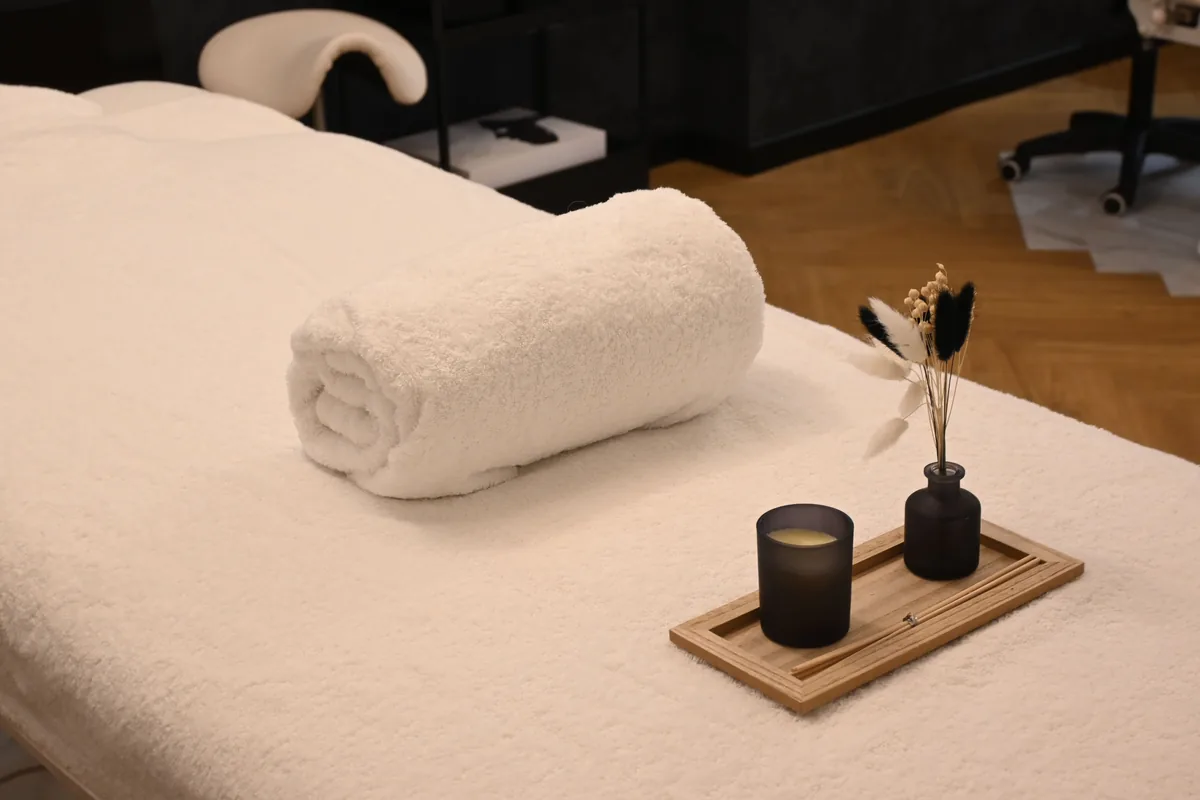 Prepared massage table in a warm, comfortable spa room